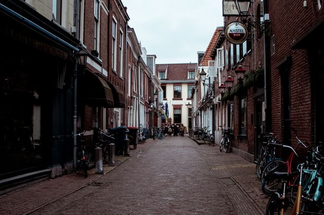 Picturesque street in Leeuwarden, Netherlands with bicycles and historic architecture.