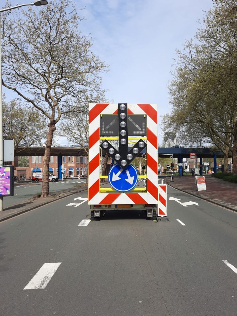 Urban street with a prominent traffic sign and residential buildings in Den Haag.